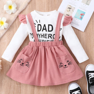 2-piece Toddler Girl Letter Print Ruffled Long-sleeve Ribbed Top and Cat Embroidered Waffle Suspender Skirt Set